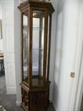 Lighted, Small but tall wood curio w/glass shelves and perfect for your collections.