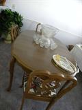 French Provincial Dining Room Table and 6 Chairs. Also included French Buffet with shelves and storage area...Vintage Punch Bowl & matching cups,trays, several sets of silverware.....