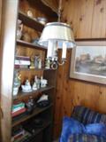 Bookcase to the left of the sofa...This is loaded with books, little items to add to your collections...Hanging Swag Lamp, Lamps, accessories....Cleaning Supplies...