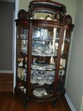 Beautiful Dark Oak Curved Curio w/beveled mirrored Bonnet/Carved Lions Body.Simply Beautiful....
This piece was owned by Geroge R. & Helen Tucker who married in the early 1930's. He ran a grocery in South Nashville/Retired to Nolensville. Lots of Middle Tennessee History...
4' x 1'5"-approx.
