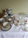 Several tea sets with matching cups/saucer/plates.