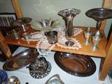 Assorted silver & sterling items: Sterling Baby cups, Salt/pepper and compote. Silver-plated serving trays/sugar/creamers. Sterling Candelabra's w/etched glass globes (vintage).etc.