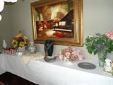 Assorted vases, containers,pewter, press glass, framed artwork, assorted frames. Lace & satin tablecloths, lamps, etc...