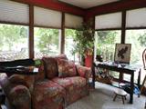 Sunroom located just off the Kitchen/Breakfast Room....This is where you will find the antique 1850's marble/walnut sideboard,,,,,sofa, Tv/Armoire
Beautiful like NEW Baby Bed....GREAT PRICE.........