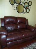 Leather LoveSeat w/Recliner blt-in....Located in Den with lots of accessories....