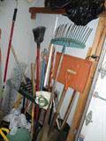 This is located on the right inside of garage, rakes, shovels,brooms, hoe, etc., etc...