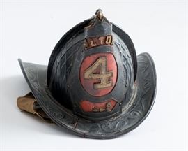 Historic Alton, Illinois Leather billed firemen's helmet from the 1880's.  This fire helmet is one of a kind. There is a brass eagle on the top with it's bill over the front shield showing the city of Alton.  The leather is in pretty good shape for as old as it is.  There is one crack in the leather in the front of the hat. This helmet is a Caims 92 4 comb leather helmet with a cross comb pattern.  It is a parade weight helmet circa 1880s.
