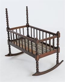 This antique walnut spindle cradle is absolutely adorable.  It is 36 1/2 inches long and 19 inches wide.  The posts are at the left end are 39 inches high from floor to top of the post and on the right side 26 1/2 inches high from floor to the top of the post.  The mattress has been custom made to fit the cradle and has never been used. 