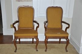 Two matching gold arm chairs