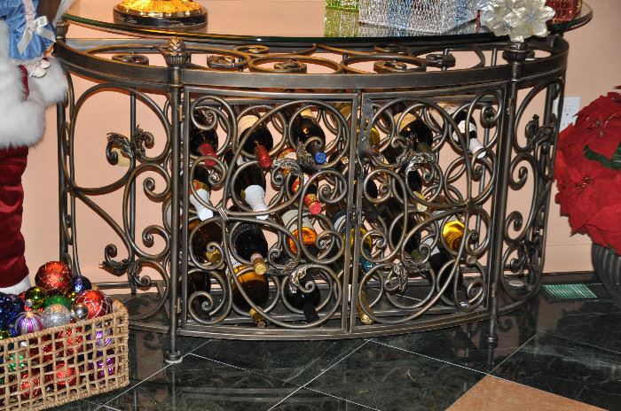 Great metal wine rack foyer table that opens to reveal the stored bottles!