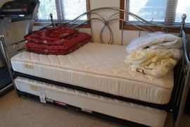 very nice metal day bed w/trundle & includes burgundy bedding
