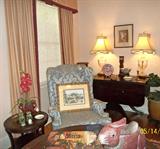 Pair of heavy crystal lamps with custom designer shades; mahogany drop-leaf Duncan Phyfe type dining table; excellent wing chair (see separate photo); tiny, antique books; silk potted orchid; custom drapes.