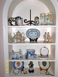 Shelves full of plates, figurines, collectables, etc.