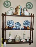Mahogany hanging shelf with some lovey and unusual accessory items including pair of Staffordshire type dogs, a teapot, reclining Dalmations, and blue and white plates.