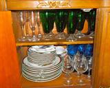Just a peek beneath the dining room china cabinet: Green/clear Tetley teas, crystal champagnes, blue wines and part of set of Christmas china!
