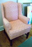 Another very comfortable wing chair covered in a shrimp-colored fabric. Very comfortable and soothing comfort!