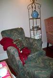 What a comfortable reading club chair with ottoman. Upholstery in very good condition. The tall brass etagere makes great display for your collectables.