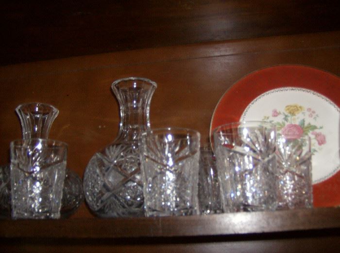 Cut crystal decanters and glasses antique plate showing at right 