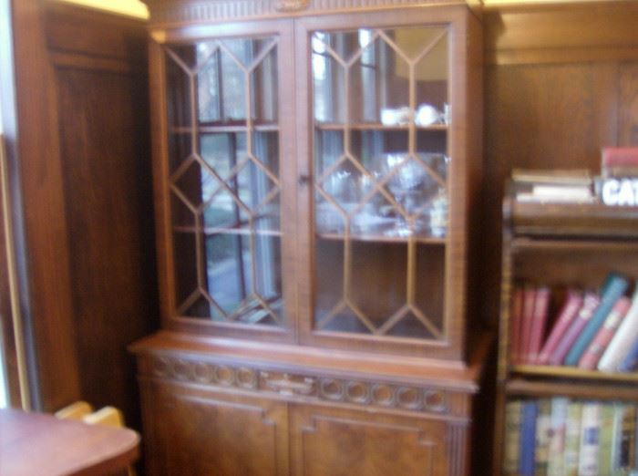 China cabinet,  modest size to fit anywhere.  Glass doors opening on 3 shelves,  doors to shelf storage below. Matching buffet available 