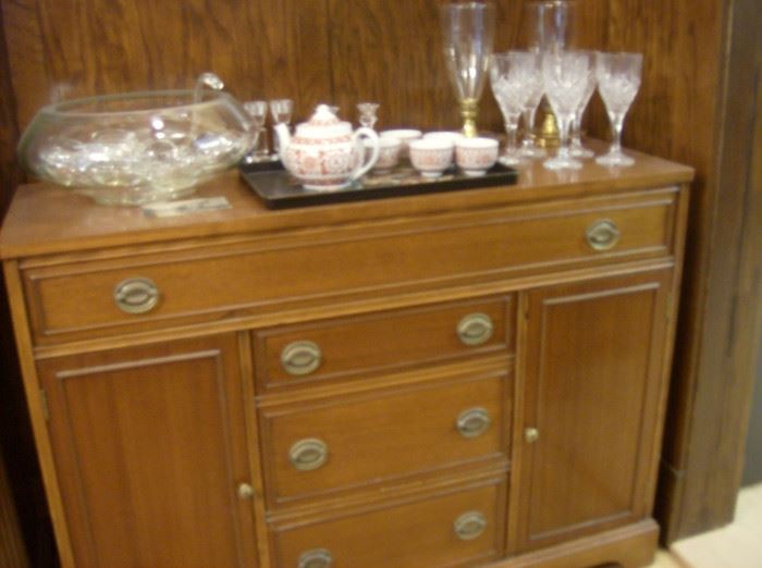 Buffet, silver storage drawer, side cabinets with shelf , 3 storage drawers.    Also shown, crystal punch set, Japanese tea set, . Stem wines, Pr candle sconces. 