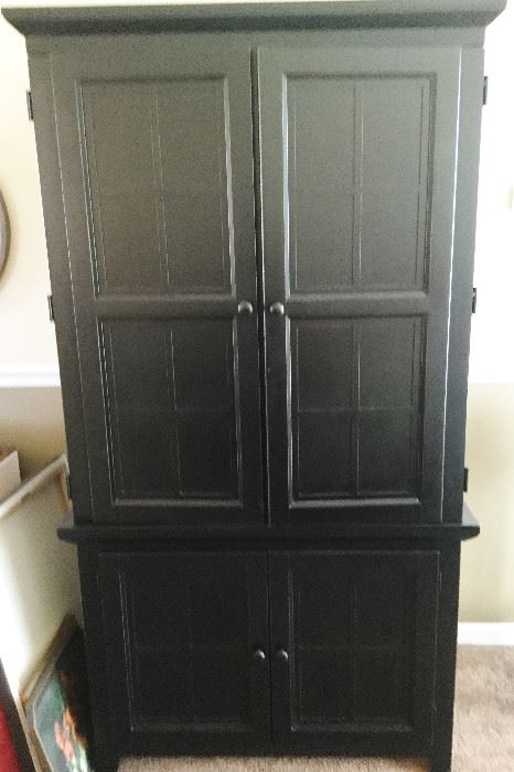 Black Wood entertainment Center by Riverside:measures: 46" x 22.5" x 76"