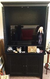 inside entertainment center--( items shown will be sold separately)
