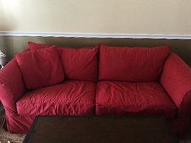 red sofa- slipcover is removable: measures: 84 x 38 x 31-- has 2 pillows- not just the 1