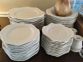 purchased in France- set of table ware-- white with pretty floral accents- matches any decor