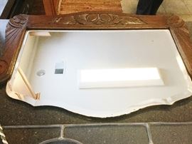 antique mirror with attached rope cord for hanging