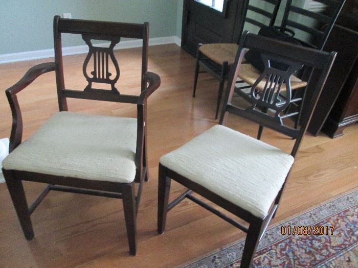 Two of the 6 mahogany lyre back chairs