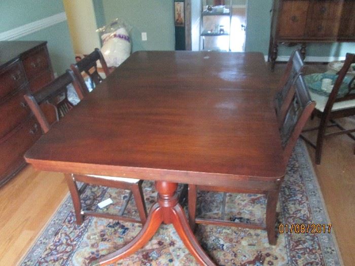 Mahogany Duncan Phyfe double pedestal dining table and 6 lyre back chairs