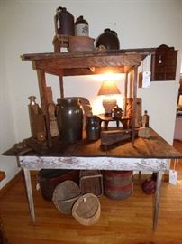 Primitive farm tables, Rose Distilleries jug, S R Rogers signed churn, Meaders face jug, E C Brown jug, W T B Gordy jardiniere