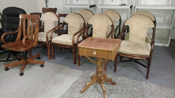 Lots of beautiful bamboo dining chairs. Pedestal table with drawer. Rolling antique desk chair.
