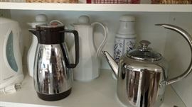 Lots of coffee carafes 