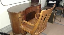 Kidney shaped antique desk.