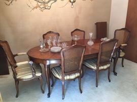 Kindel Sofa and Six chairs which need new cushions.  Table has Two leaves