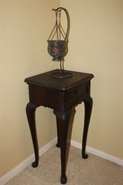 queen anne style table with metal candle holder