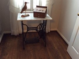 Converted Singer Sewing Machine cast iron bottom with a marble top.