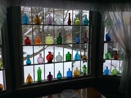 Some of over 100 antique and vintage bottles