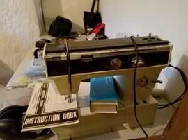 sewing machine, modern and old time singer