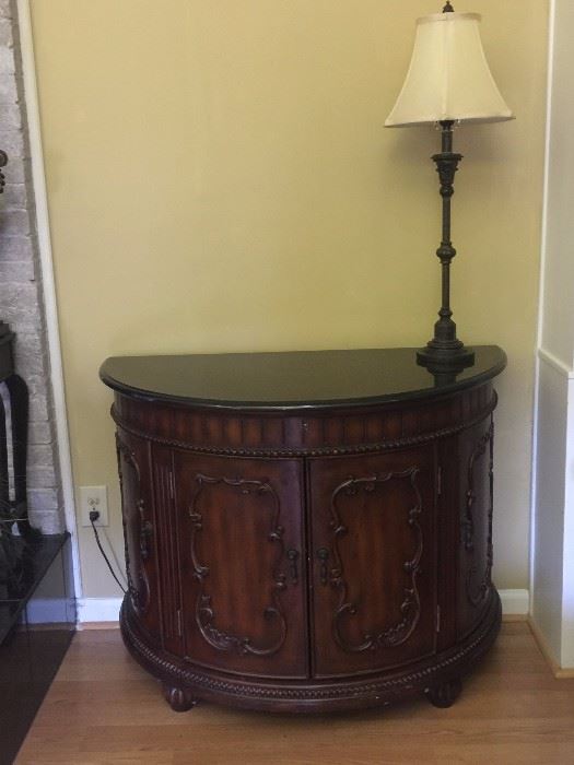A demilune table that can be filled with treasures you find at this incredible sale!
