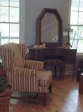 KIDNEY SHAPED MAHOGANY VANITY, SHAPED MIRROR, BENCH AND WING CHAIR