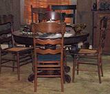 ANTIQUE 1910 OAK PEDESTAL ROUND TABLE WITH SCROLL LEGS AND ANTIQUE CANE SEAT LADDERBACK CHAIRS
