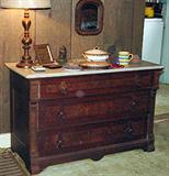 ANTIQUE MID - LATE 1800'S FLAME MAHOGANY VICTORIAN CHEST OF DRAWERS WITH MARBLE TOP AND ANTIQUE BRONZE CANDLESTICK DESIGN LAMP
