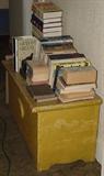 ANTIQUE OCHRE PAINTED LIDDED BLANKET CHEST AND ANTIQUE AND NEWER BOOKS