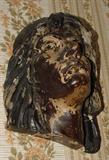 DETAIL OF ANTIQUE CARVED HEAD