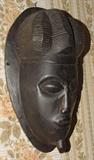 DETAIL OF ANTIQUE CARVED WOODEN HEAD FROM THE CONGO