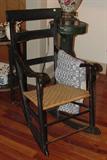 ANTIQUE BLACK PATINATED ROCKER... BETTER HAVE A SMALL BUTT AND ANTIQUE WOVEN CLOTH