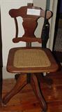 ANTIQUE ADJUSTABLE CANE SEAT DESK CHAIR