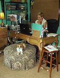 MARY AT WORK AT HER OVER THE TOP GILT FRENCH INSPIRED LADY'S DESK. ROUND MONKEY OTTOMAN AND HER PUP